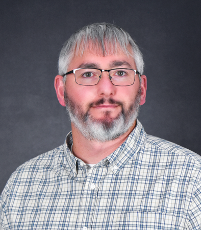 Kevin Sentieri, a Caucasian man with a light colored patterned shirt