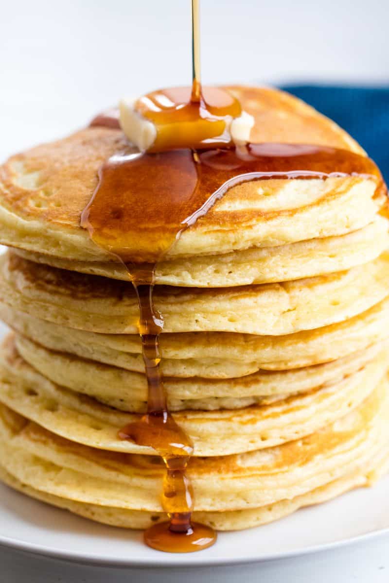 Stack of pancakes with maple syrup on them